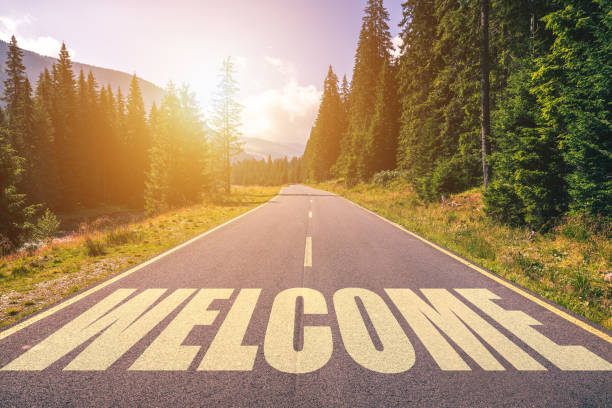 istock Welcome word written on road in the mountains 1027521708