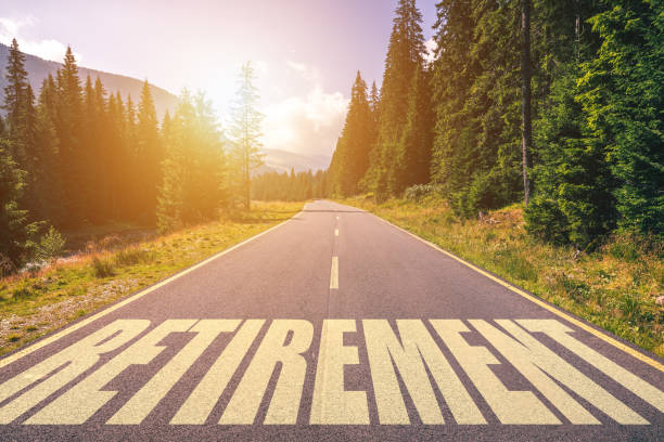 Retirement word written on road in the mountains Retirement word written on road in the mountains gold to ira stock pictures, royalty-free photos & images