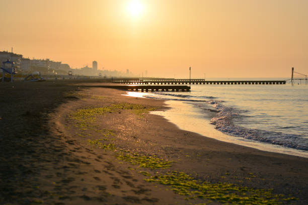 istock dawn rises on the piers and on the coast 1027527856