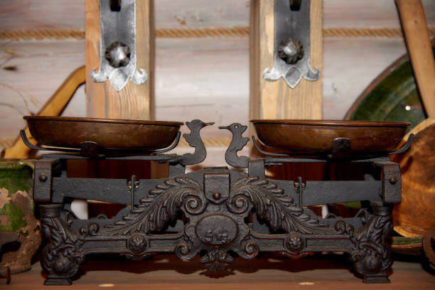 istock Ancient scales on a wooden background 1027536476