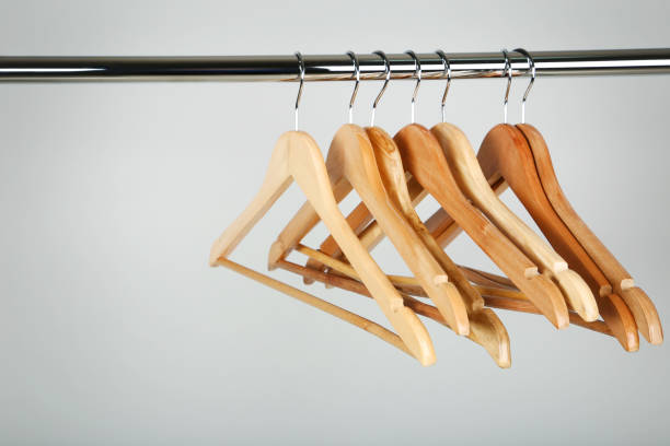 istock Wooden clothes hangers on grey background 1027537328