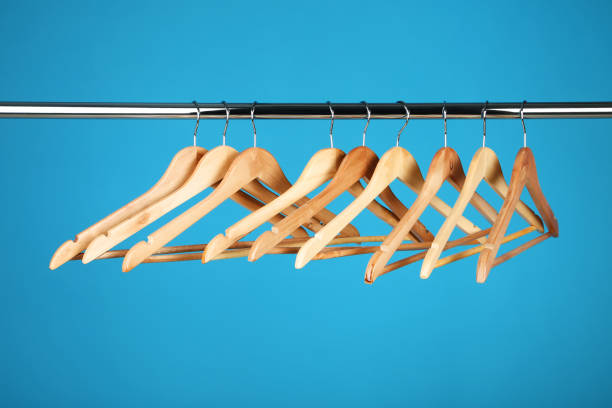 istock Wooden clothes hangers on blue background 1027540046