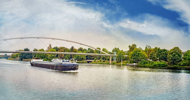 istock Barge under the Hoger Brug (Higher Bridge) on the River Maas. 1027543652