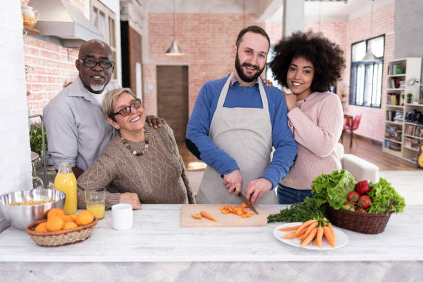 istock Multi ethnic family preparing food at home 1027546886