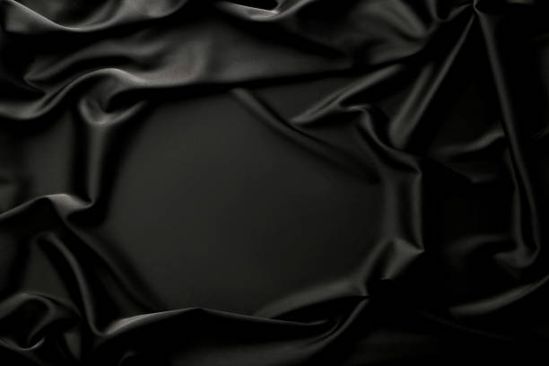istock Background of black satin fabric 1027550224