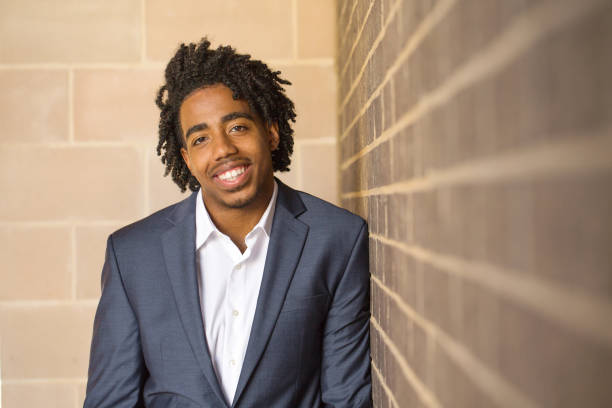 istock Young handsome African American man smiling outside. 1027558422