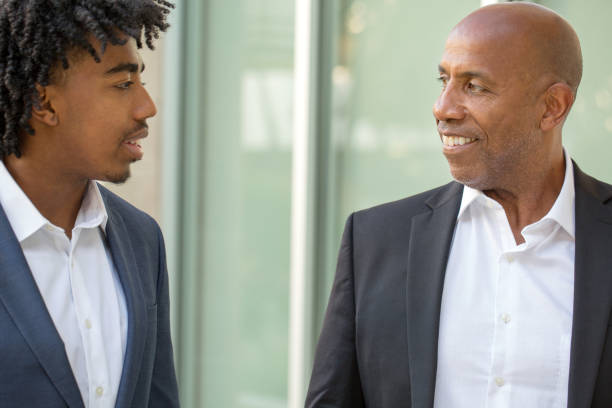 istock Mature African American casually dressed businessman shaking hands. 1027560296