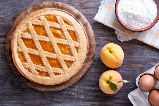 istock Tart with peach jam on wooden rustic table 1027560302