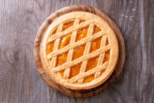 istock Tart with peach jam on wooden rustic table 1027560306