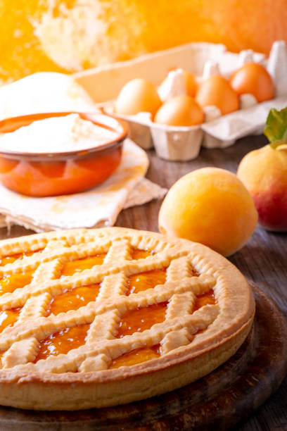 istock Tart with peach jam on wooden rustic table 1027560312