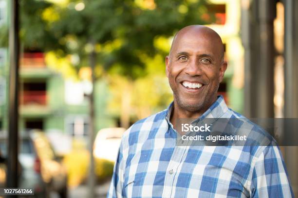 Happy Mature African American Man Smiling Outside Stock Photo - Download Image Now - African-American Ethnicity, African Ethnicity, Males