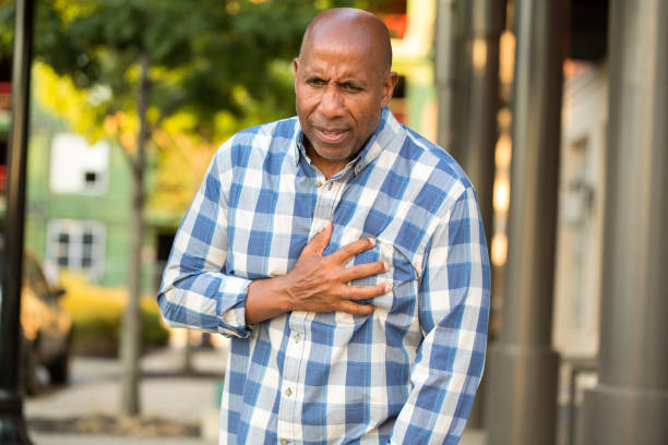istock African American man having pains holding his chest. 1027563530