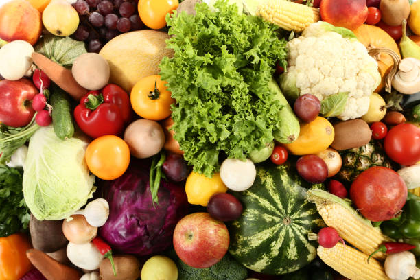 istock Ripe fruits and vegetables background 1027570380