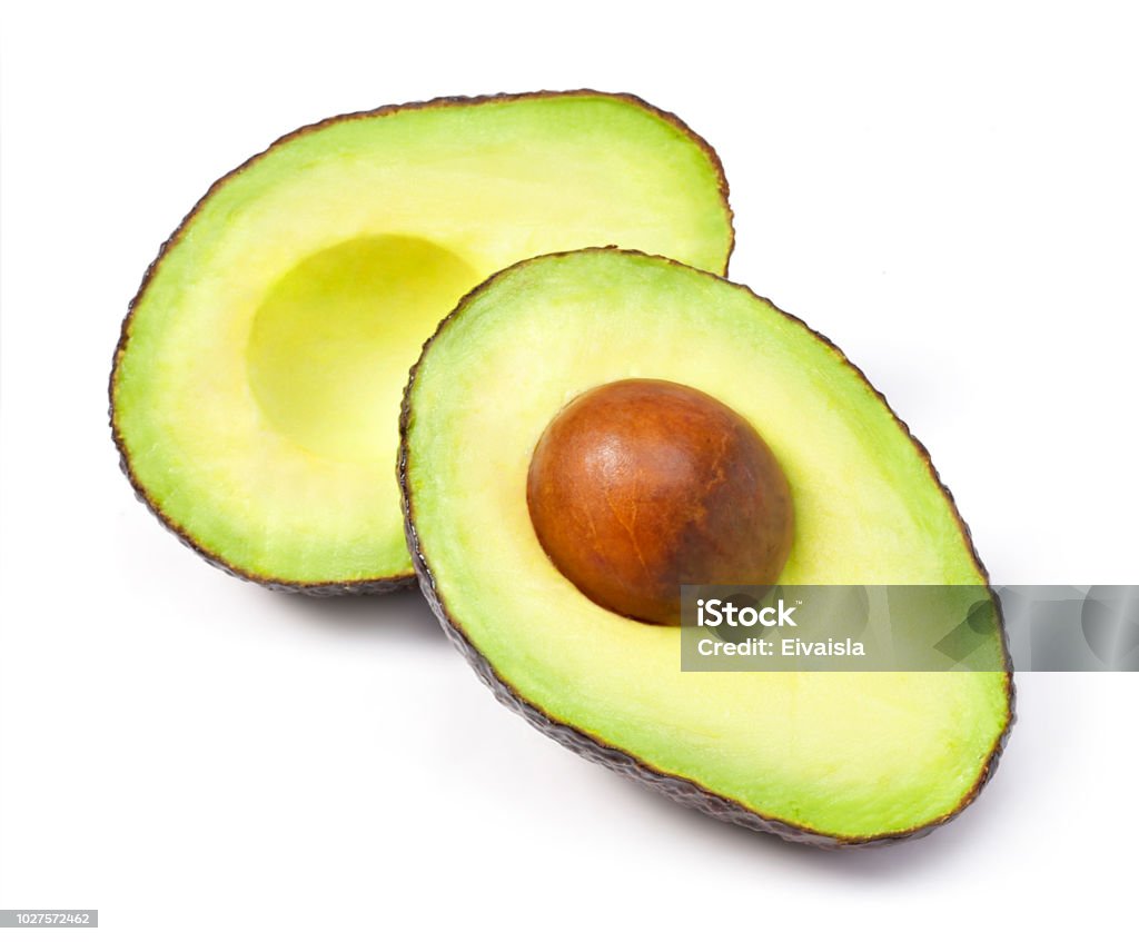 Delicious fresh avocado fruit, isolated on white background Delicious fresh avocado fruit, isolated on white background. Cross section of avocado, healthy eating or lifestyle theme. Avocado Stock Photo