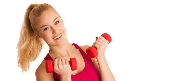 Cute young blond woman working out in fitness gym isolated over white background