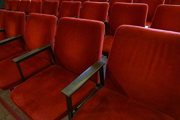 istock Rows of red soft chair seats close up 1027582942