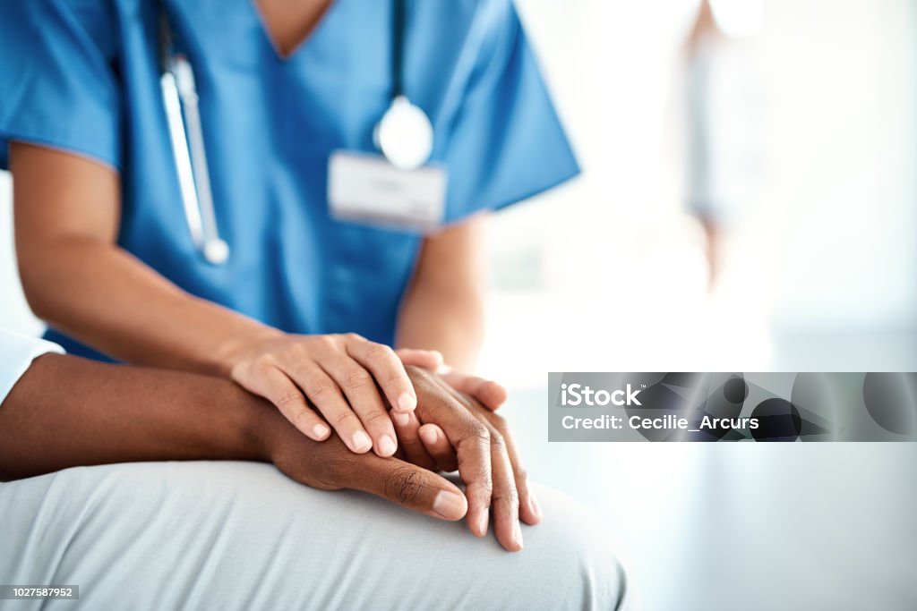 I'm here for you Cropped shot of an unrecognizable female nurse comforting a patient in the hospital Patient Stock Photo
