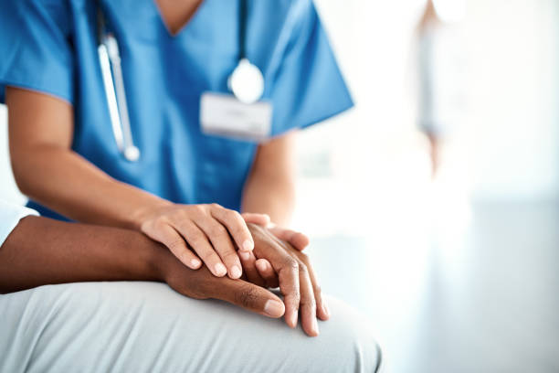 I'm here for you Cropped shot of an unrecognizable female nurse comforting a patient in the hospital uniform photos stock pictures, royalty-free photos & images