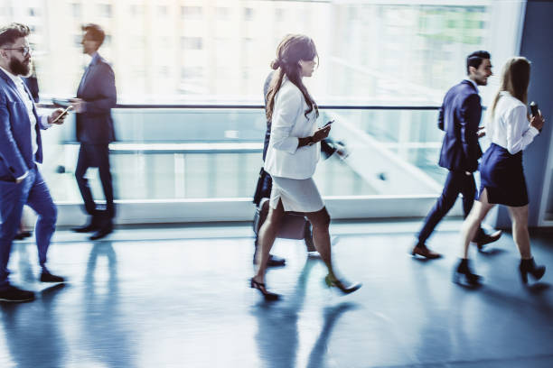 istock Business People Walking Down The Hallway 1027590456