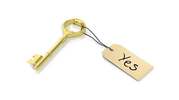 istock Tag with word Yes on golden retro key , isolated on white background. 1027594020