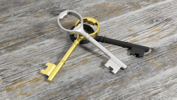 istock 3D golden and silver retro keys on wooden surface 1027594170