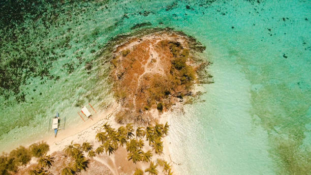 istock Aerial view beautiful beach on a tropical island Malcapuya. Philippines 1027594382