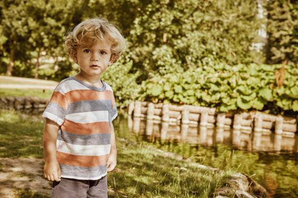 istock child 2 years old in public park 1027599608
