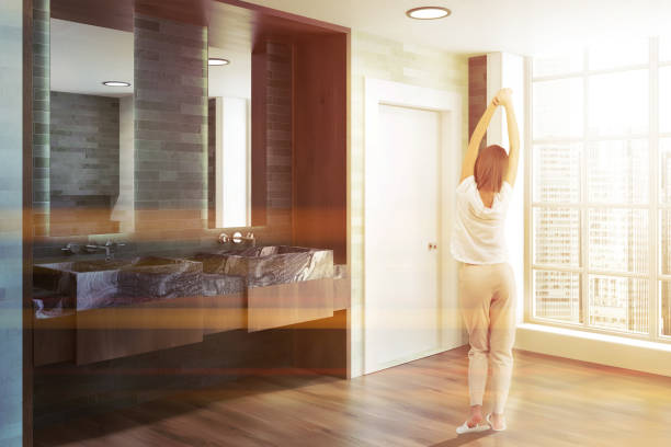 istock White and emerald luxury bathroom, woman 1027599712