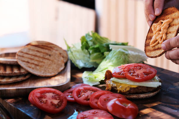 istock Male chef hands preparing burgers 1027600236