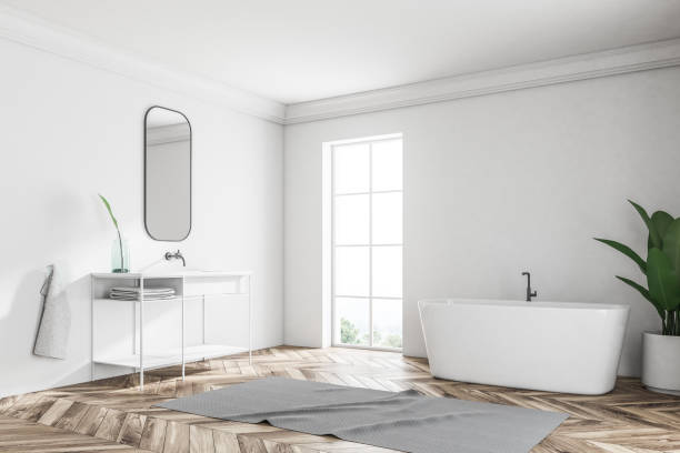 istock White loft bathroom corner, tub and sink 1027603116