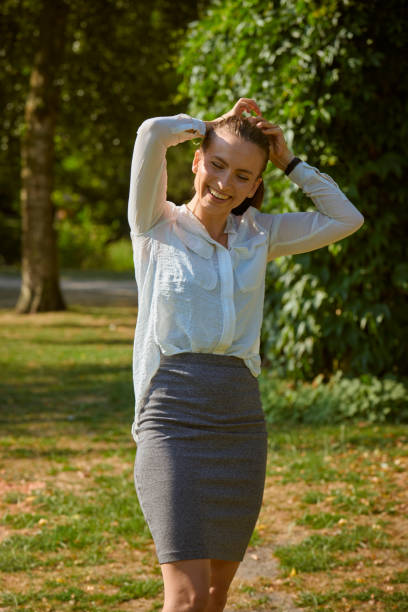 istock young woman playing with her hair 1027603616