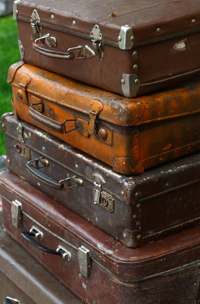 istock Stack of old vintage travel suitcases close up 1027607850