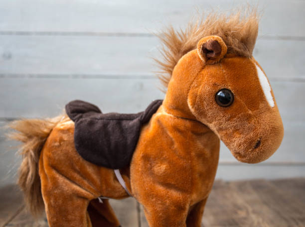 istock a beautiful red horse with a saddle kid toy 1027608110