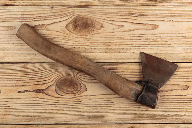 istock Old Axe on a wooden background 1027613642