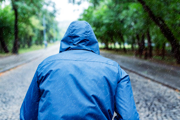 istock Man Jogging on a Rainy Day in the Park 1027614790
