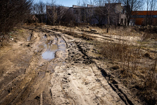 istock Deep car rut on a dirt road 1027615128