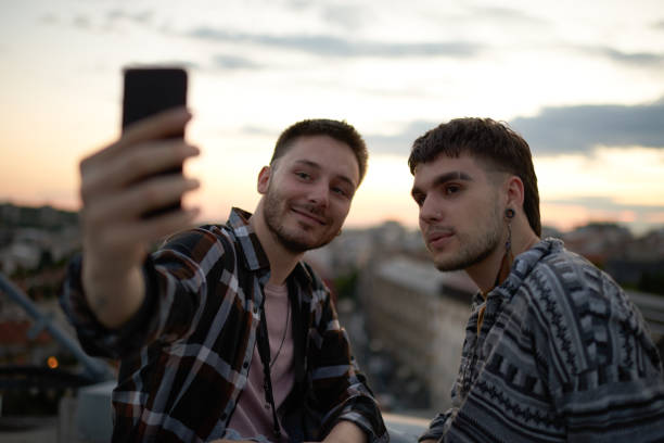 istock Gay couple taking selfie image 1027633650