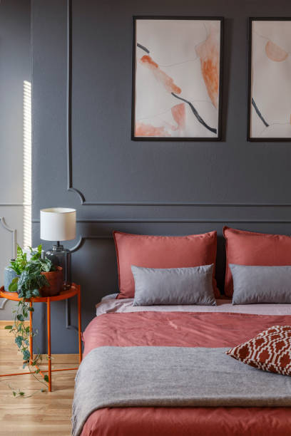 istock Pink and grey hotel bedroom 1027642750