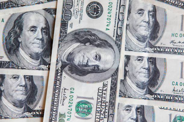 istock Background with money american hundred dollar bills 1027646184