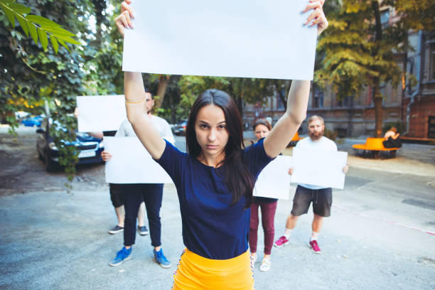 istock Group of protesting young people outdoors 1027650162