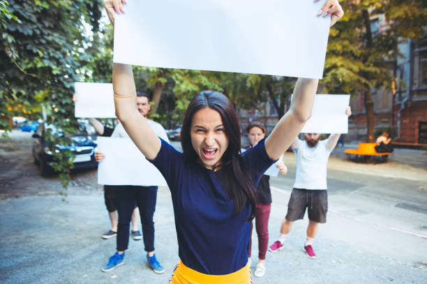 istock Group of protesting young people outdoors 1027650322