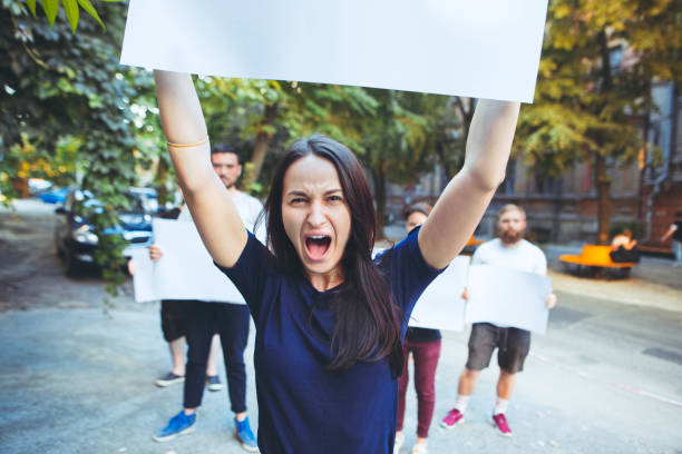 istock Group of protesting young people outdoors 1027652782
