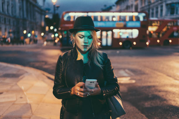 istock Woman in London texting late at night 1027653276