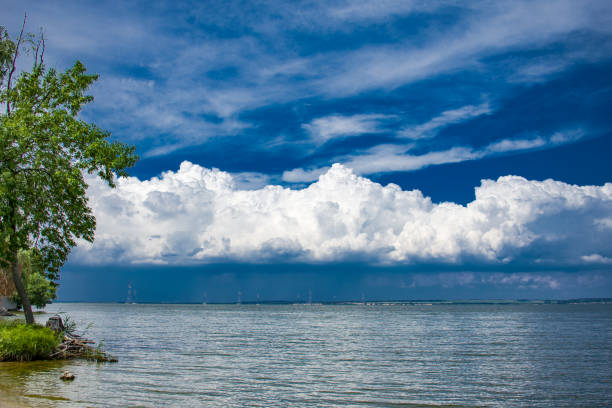 istock beautiful beach on the background of an unusual cloudy sky 1027674750