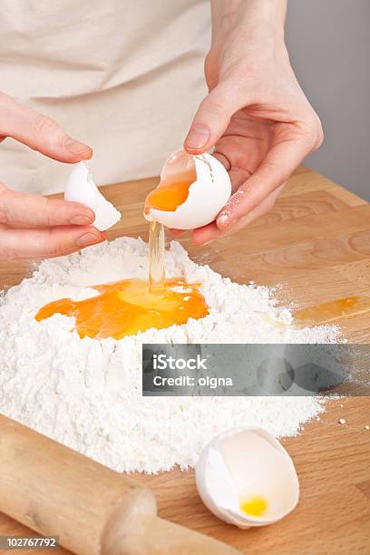 Breaking Eggs For The Dough Stock Photo - Download Image Now - Animal Egg, Apron, Beaten Up