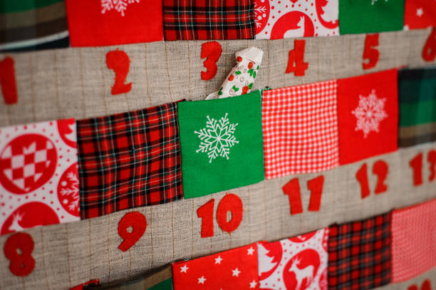 istock Soft textile Christmas calendar with pockets on the wall 1027682822