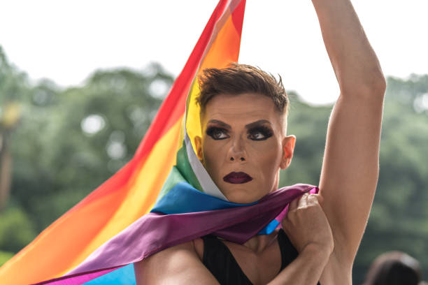 istock Gay Boy Holding Rainbow Flag 1027683296