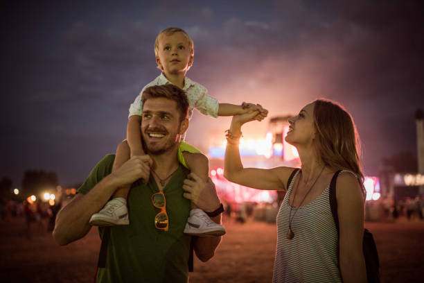 istock Young family with son on street fair. 1027684426