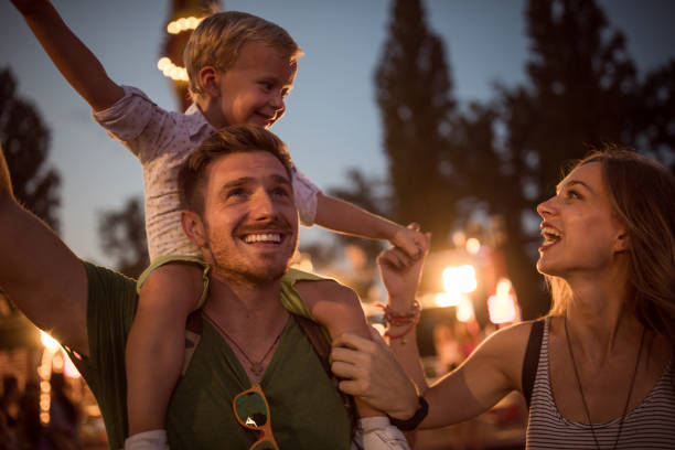 istock Young family with son on street fair. 1027686010
