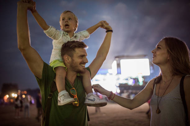 istock Young family with son on street fair. 1027686772
